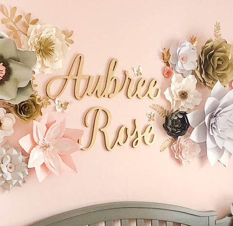 Gold Name Sign with First and Middle Name in Pink Nursery with Paper Flowers