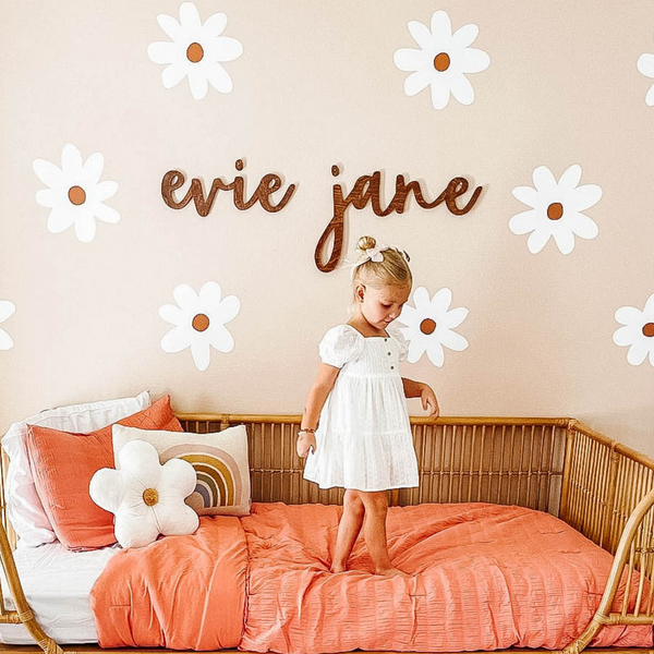 
        Custom name sign for girls room with baby girl name sign over the bed or crib and nursery name sign with daisy wall decals and boho nursery
        