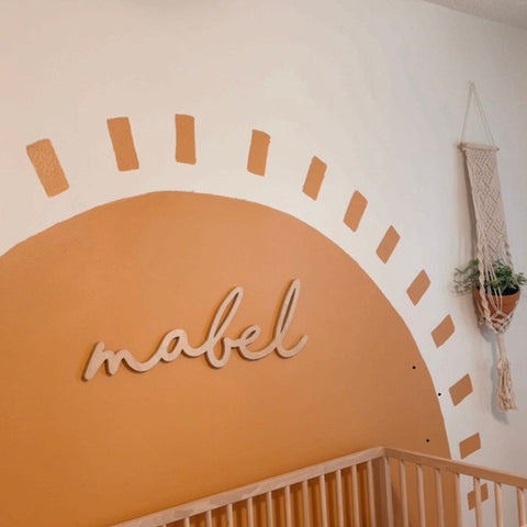 Boho Style Name Sign in Sun-Themed Nursery